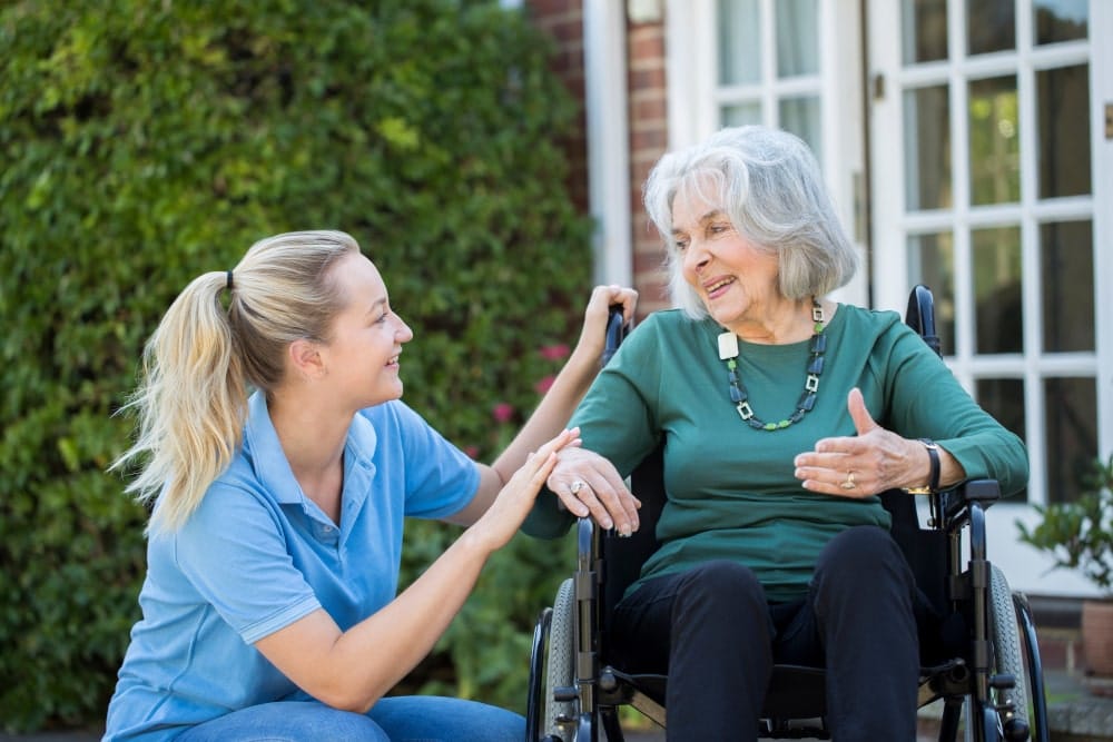Lady in Wheelchair with Carer